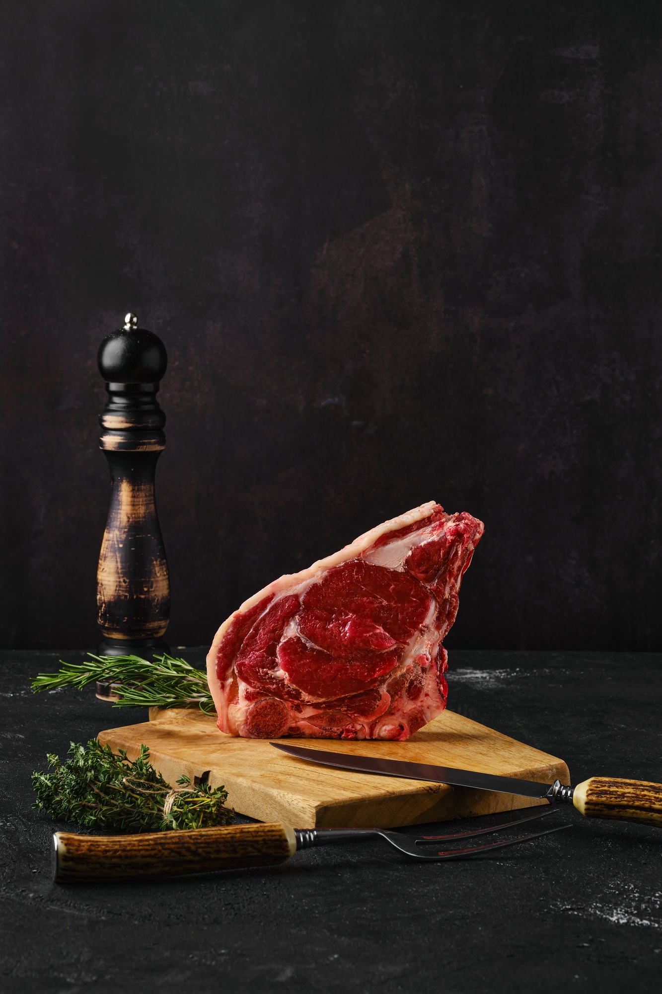 Raw strip steak bone in